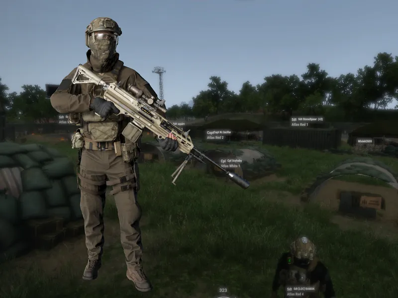 Un soldat LGC en tenue complète, fusil en main, devant les positions